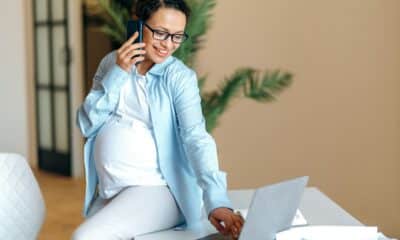 work pregnant woman mixed race adult happy online laptop